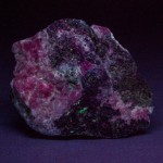 Hodgkinsonite fluorescing under longwave ultraviolet light