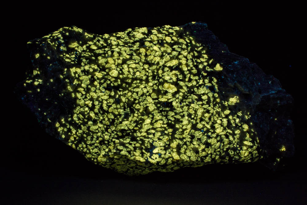Norbergite fluorescing under shortwave ultraviolet light