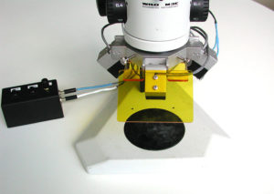 Early prototype fluorescence adapter, installed on microscope
