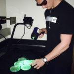 Graduate student Brice Jarvis (Sedbrook lab) using the NIGHTSEA DFP to locate transgenic pennycress seedlings
