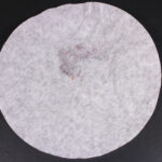 Coffee filter with collected fibers